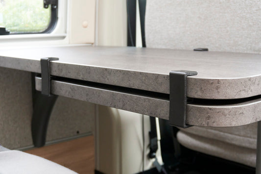 Table spacer for swivel tables in motorhomes